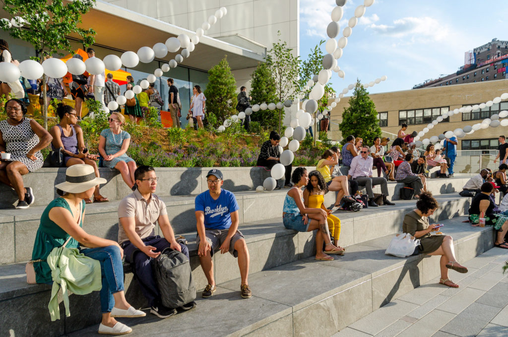 People sitting on terrace at BAM Plaza