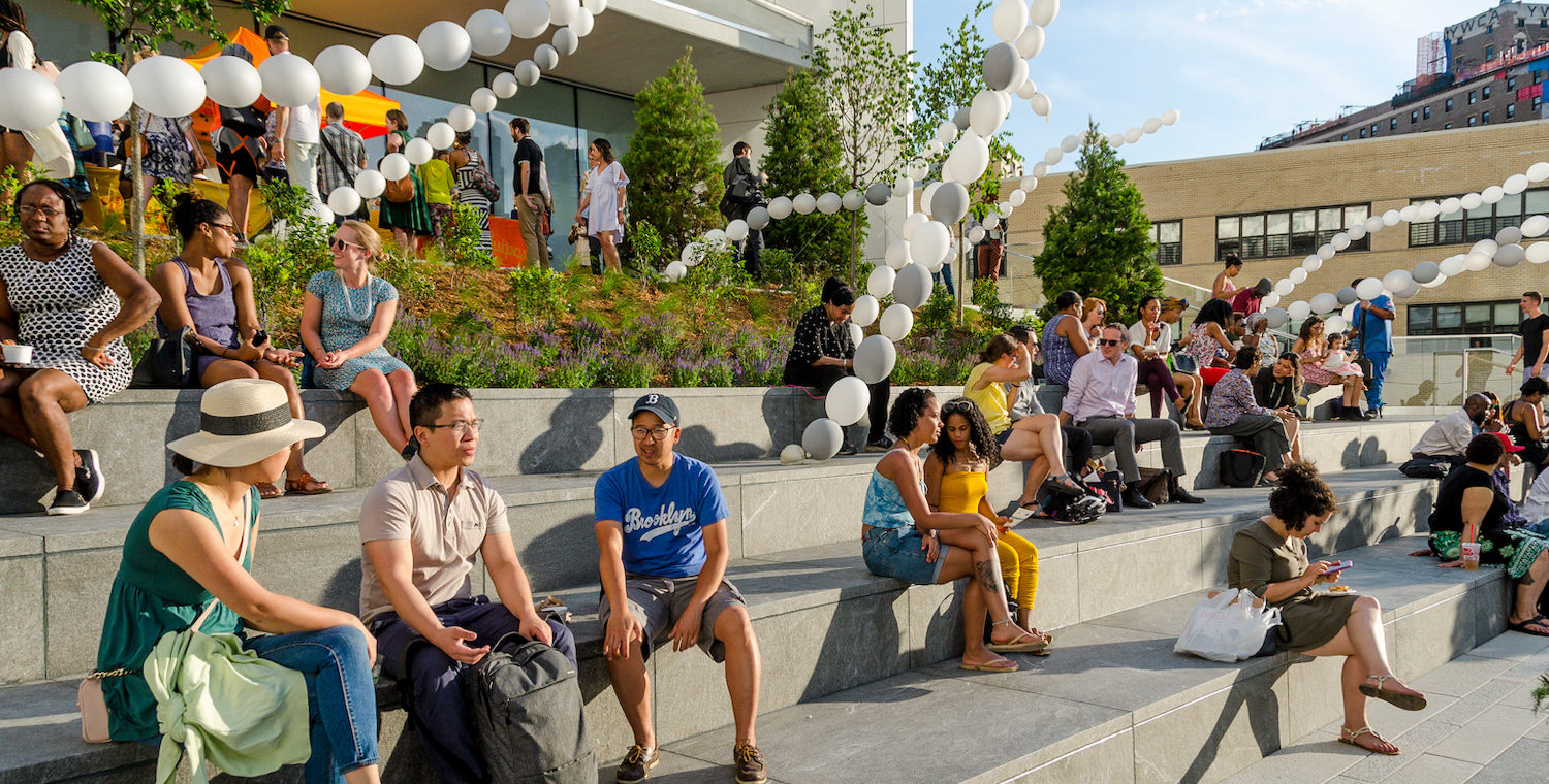 People sitting on terrace at BAM Plaza