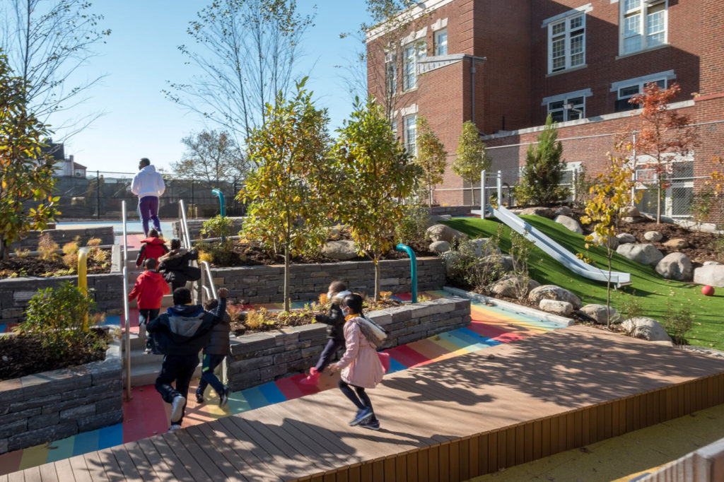 PS 16 Wakefield Playground kids running up terraced steps