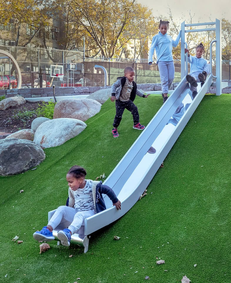 PS 16 Wakefield Playground kids on slide