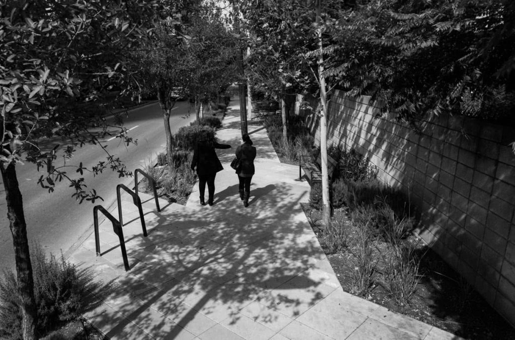 Black and white photo of walkway and bike rack at Distrito Valle del Campestre